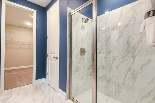 222 Thornberry Way, Palm Coast, FL 32164 - bathroom with a marble finish shower, a walk in closet, and marble finish flooring