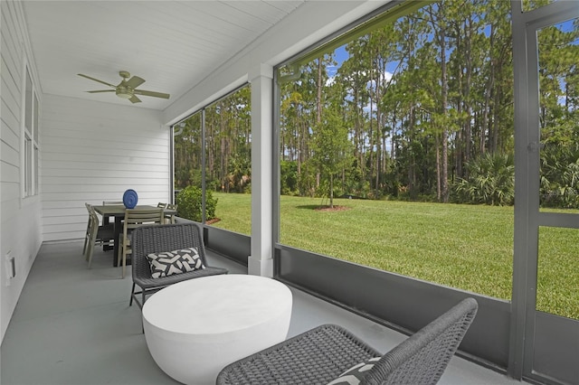 222 Thornberry Way, Palm Coast, FL 32164 - sunroom with ceiling fan and outdoor dining space