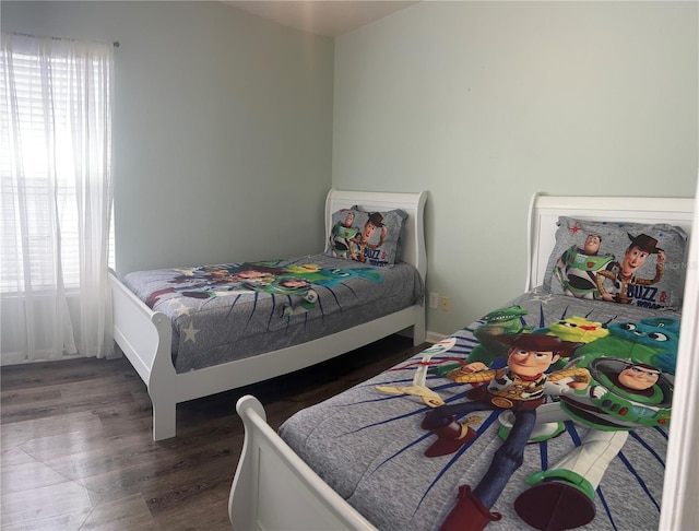 8121 Fan Palm Way, Kissimmee, FL 34747 - bedroom featuring wood finished floors and baseboards