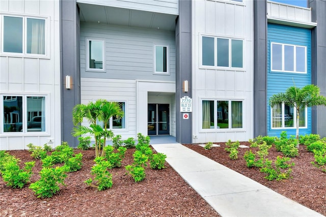 7770 Sandy Ridge Dr Unit 142, Kissimmee, FL 34747 - doorway to property featuring board and batten siding