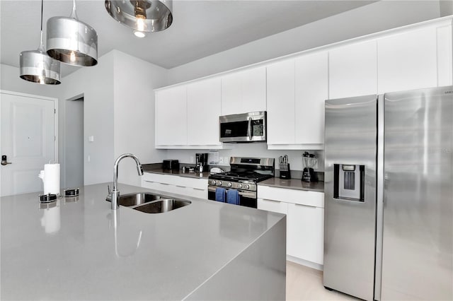 7770 Sandy Ridge Dr Unit 142, Kissimmee, FL 34747 - kitchen featuring stainless steel appliances, white cabinetry, pendant lighting, modern cabinets, and dark countertops