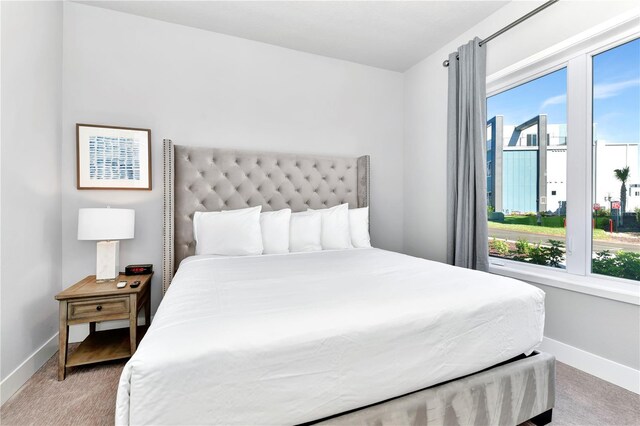 7770 Sandy Ridge Dr Unit 142, Kissimmee, FL 34747 - bedroom with baseboards and light carpet