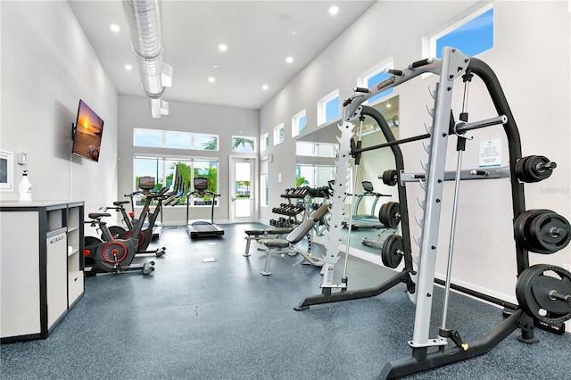 7770 Sandy Ridge Dr Unit 142, Kissimmee, FL 34747 - exercise room featuring a towering ceiling and recessed lighting