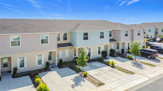 4850 Coral Castle Dr, Kissimmee, FL 34746 - multi unit property with a shingled roof, stucco siding, and a residential view