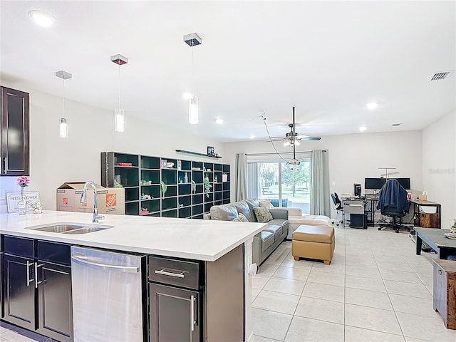 4850 Coral Castle Dr, Kissimmee, FL 34746 - kitchen featuring stainless steel dishwasher, light tile patterned floors, a ceiling fan, a desk, and light countertops