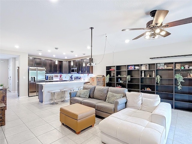 4850 Coral Castle Dr, Kissimmee, FL 34746 - living room featuring light tile patterned floors, a ceiling fan, and recessed lighting
