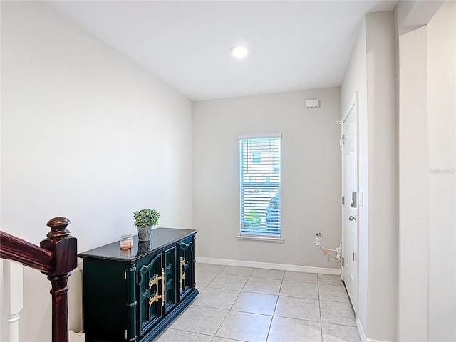 4850 Coral Castle Dr, Kissimmee, FL 34746 - corridor featuring baseboards and light tile patterned floors