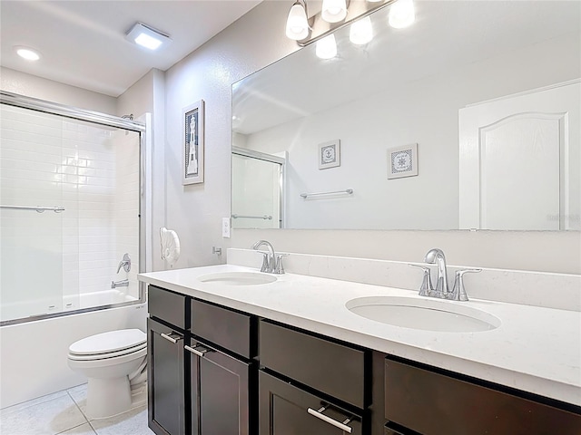 4850 Coral Castle Dr, Kissimmee, FL 34746 - bathroom featuring double vanity, tile patterned flooring, and combined bath / shower with glass door
