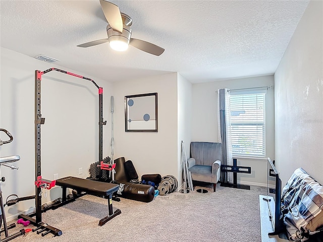 4850 Coral Castle Dr, Kissimmee, FL 34746 - workout room with carpet flooring, a textured ceiling, and ceiling fan