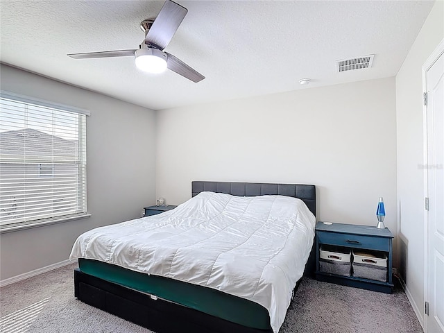 4850 Coral Castle Dr, Kissimmee, FL 34746 - bedroom with carpet flooring, ceiling fan, and a textured ceiling