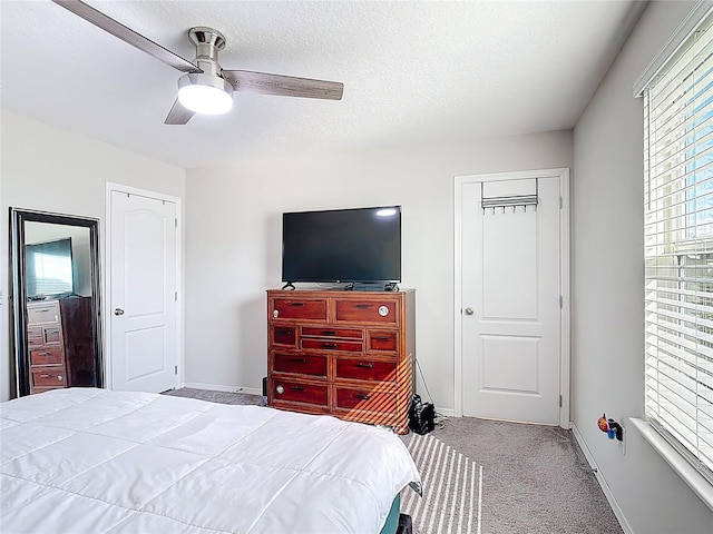 4850 Coral Castle Dr, Kissimmee, FL 34746 - bedroom with carpet floors, a ceiling fan, and a textured ceiling