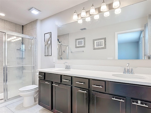 4850 Coral Castle Dr, Kissimmee, FL 34746 - bathroom with double vanity, a stall shower, and tile patterned flooring