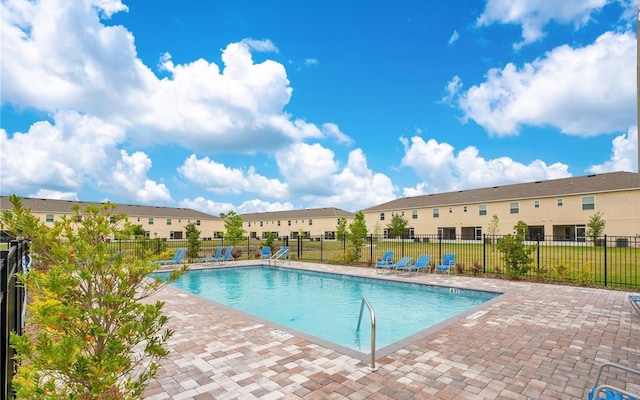 4850 Coral Castle Dr, Kissimmee, FL 34746 - community pool with a patio area and a residential view