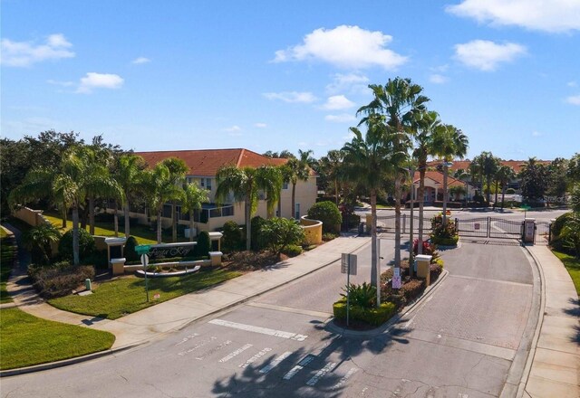 4850 Coral Castle Dr, Kissimmee, FL 34746 - view of home's community featuring a gate, uncovered parking, and a residential view