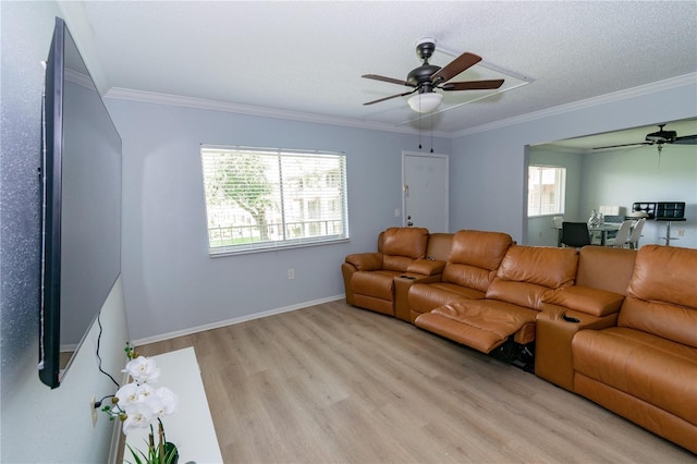 139 Oyster Bay Cir Unit 200, Altamonte Springs, FL 32701 - living room featuring a ceiling fan, light wood-style floors, crown molding, and baseboards