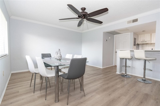 139 Oyster Bay Cir Unit 200, Altamonte Springs, FL 32701 - dining room featuring light wood-style floors, ornamental molding, baseboards, and a ceiling fan