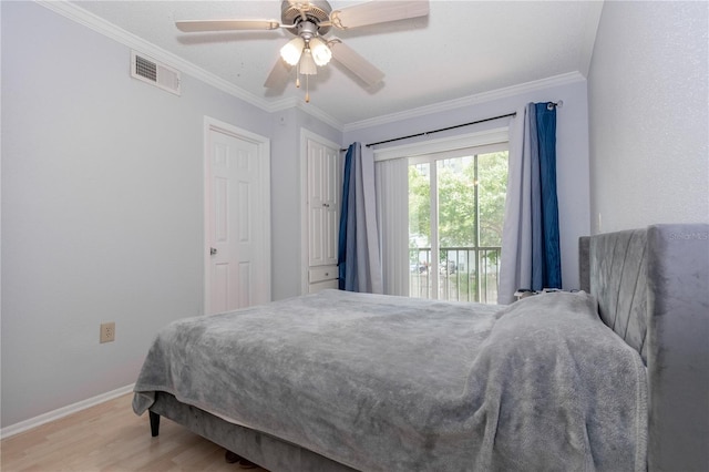 139 Oyster Bay Cir Unit 200, Altamonte Springs, FL 32701 - bedroom featuring wood finished floors, baseboards, crown molding, and ceiling fan