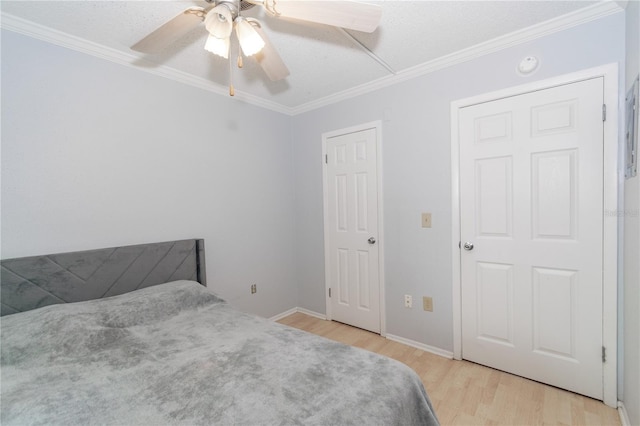 139 Oyster Bay Cir Unit 200, Altamonte Springs, FL 32701 - bedroom featuring wood finished floors, ornamental molding, baseboards, and a ceiling fan