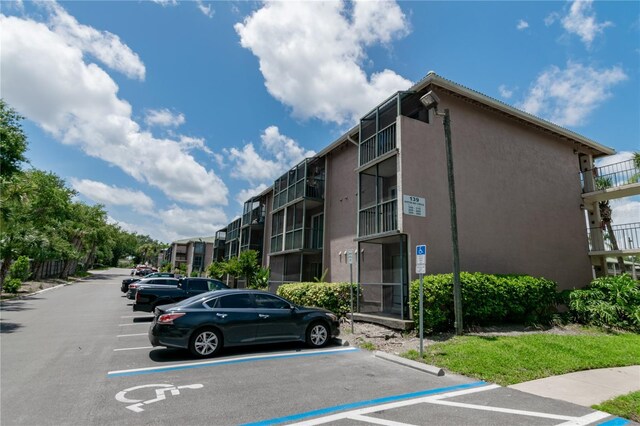 139 Oyster Bay Cir Unit 200, Altamonte Springs, FL 32701 - view of building exterior featuring uncovered parking