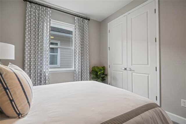 223 Thornberry Way, Palm Coast, FL 32164 - bedroom with a closet and baseboards