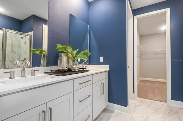 215 Thornberry Way, Palm Coast, FL 32164 - bathroom featuring double vanity, a shower stall, marble finish flooring, and a spacious closet