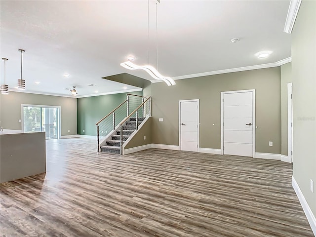 1870 Brentwood Ct, Davenport, FL 33837 - unfurnished living room featuring ornamental molding, wood finished floors, stairs, baseboards, and recessed lighting