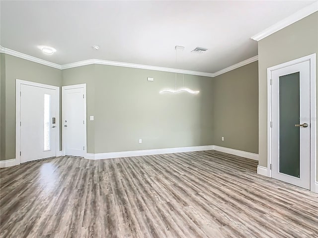 1870 Brentwood Ct, Davenport, FL 33837 - unfurnished room with crown molding, wood finished floors, and baseboards