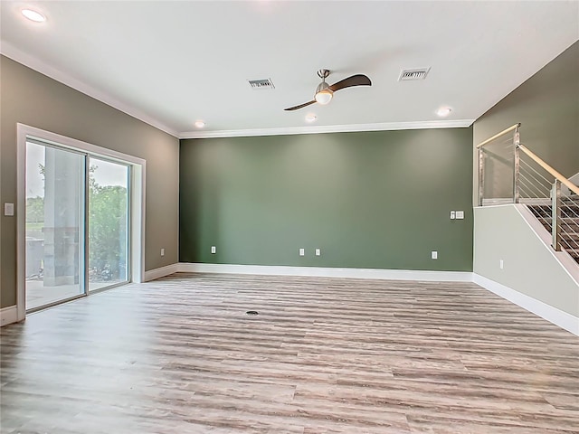 1870 Brentwood Ct, Davenport, FL 33837 - spare room with wood finished floors, ornamental molding, baseboards, recessed lighting, and stairs