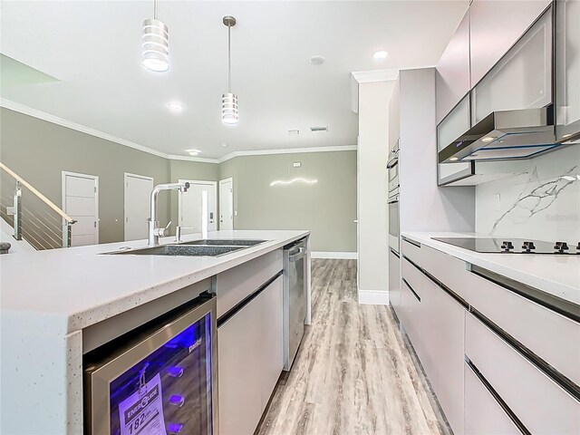 1870 Brentwood Ct, Davenport, FL 33837 - kitchen featuring wine cooler, black electric cooktop, crown molding, light wood-style floors, and a sink
