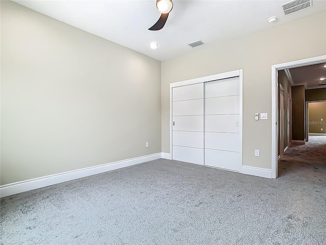 1870 Brentwood Ct, Davenport, FL 33837 - unfurnished bedroom with baseboards, a closet, carpet, and a ceiling fan
