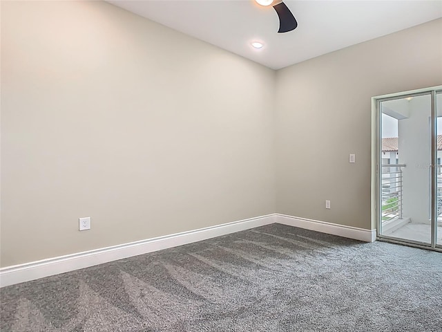 1870 Brentwood Ct, Davenport, FL 33837 - empty room with dark colored carpet, baseboards, and ceiling fan