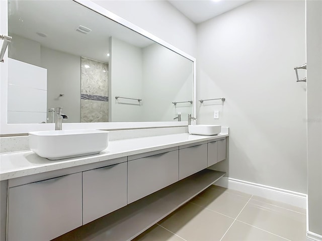 1870 Brentwood Ct, Davenport, FL 33837 - bathroom with double vanity, tile patterned flooring, and baseboards