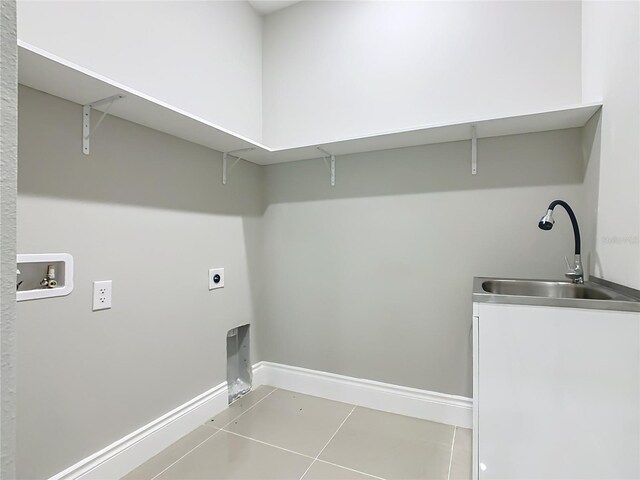 1870 Brentwood Ct, Davenport, FL 33837 - laundry area with electric dryer hookup, washer hookup, baseboards, and light tile patterned flooring