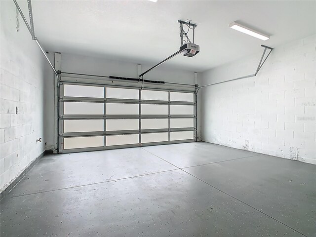 1870 Brentwood Ct, Davenport, FL 33837 - garage with a garage door opener and concrete block wall