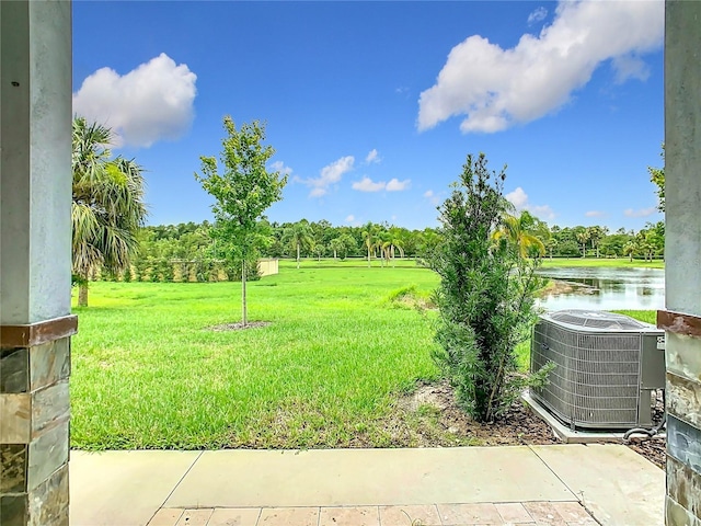 1870 Brentwood Ct, Davenport, FL 33837 - view of grassy yard with central AC and a water view