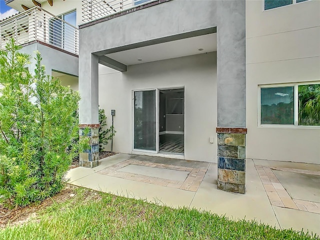 1870 Brentwood Ct, Davenport, FL 33837 - doorway to property featuring stucco siding and a patio