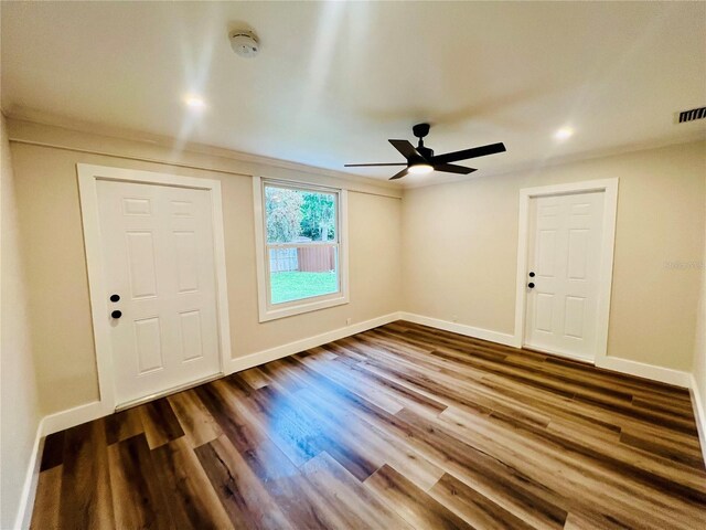 801 Leeward Way, Palm Harbor, FL 34685 - foyer entrance featuring baseboards, a ceiling fan, and wood finished floors