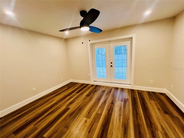 801 Leeward Way, Palm Harbor, FL 34685 - spare room featuring baseboards, ceiling fan, french doors, dark wood finished floors, and recessed lighting