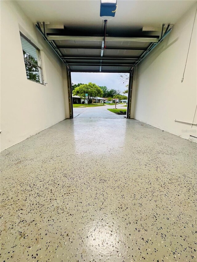 801 Leeward Way, Palm Harbor, FL 34685 - garage featuring a garage door opener