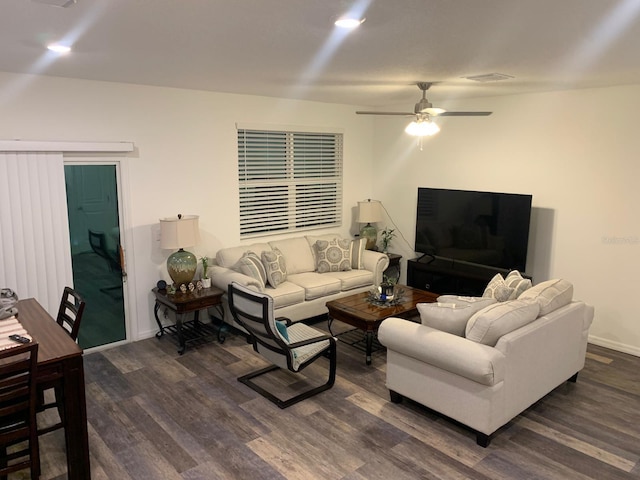 892 Grandin St, Davenport, FL 33837 - living room featuring dark wood-style flooring, a ceiling fan, and baseboards