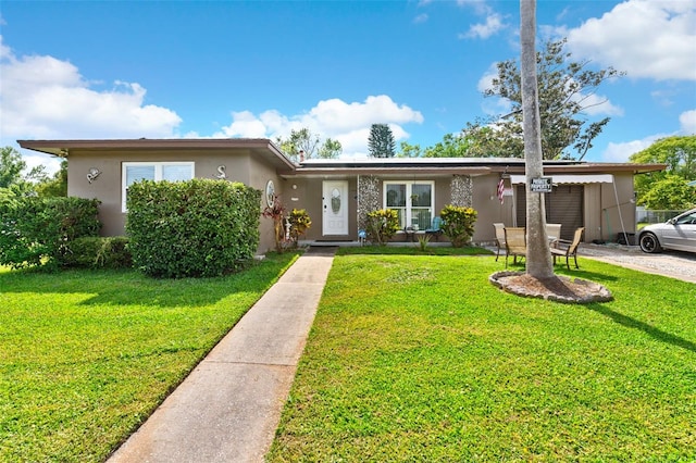 1566 Providence Blvd, Deltona, FL 32725 - view of front facade featuring stucco siding, a front yard, and driveway