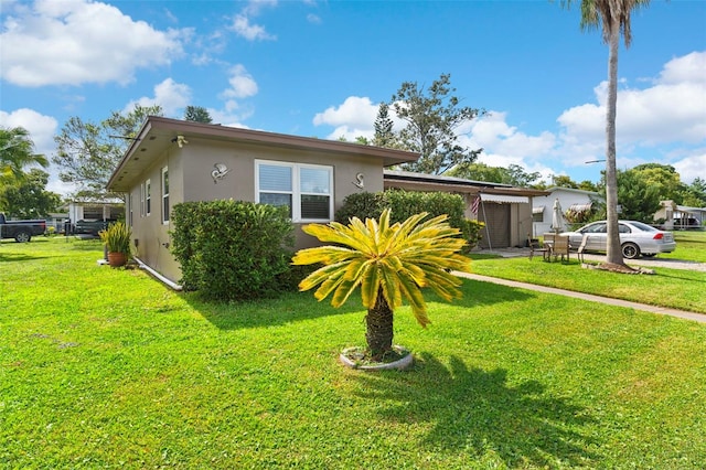 1566 Providence Blvd, Deltona, FL 32725 - view of front facade featuring stucco siding and a front yard