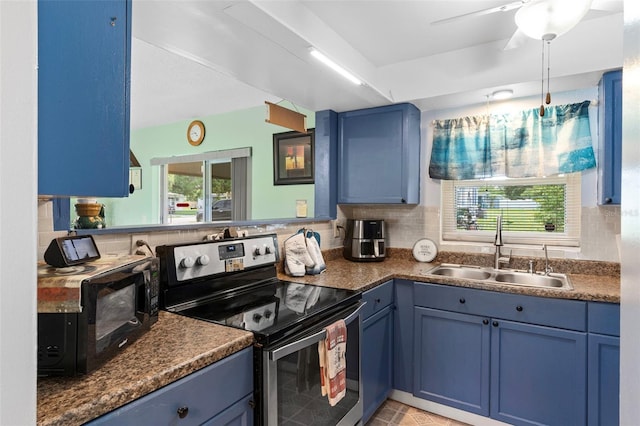 1566 Providence Blvd, Deltona, FL 32725 - kitchen with stainless steel range with electric stovetop, a sink, blue cabinetry, and healthy amount of natural light
