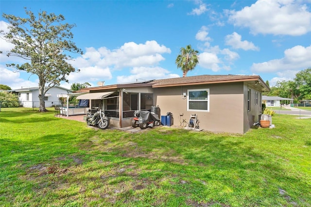 1566 Providence Blvd, Deltona, FL 32725 - rear view of property with a sunroom and stucco siding