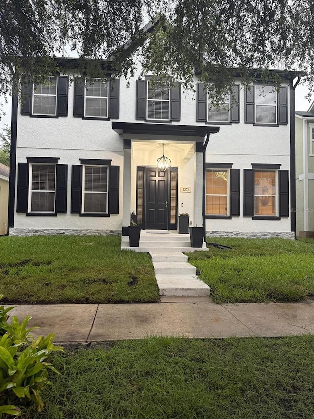 5231 Lemon Twist Ln, Windermere, FL 34786 - view of front facade with stucco siding and a front yard