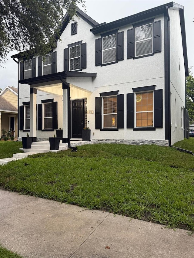 5231 Lemon Twist Ln, Windermere, FL 34786 - view of front of house with a front lawn and stucco siding
