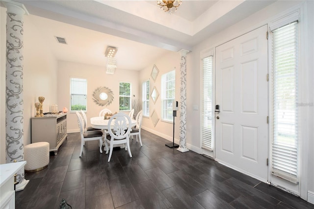 5231 Lemon Twist Ln, Windermere, FL 34786 - dining room featuring ornate columns and dark wood finished floors