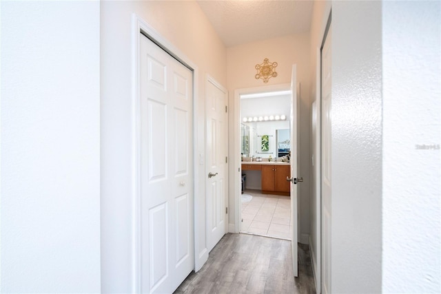 5231 Lemon Twist Ln, Windermere, FL 34786 - hallway featuring light wood-style flooring