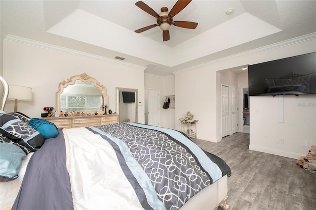 5231 Lemon Twist Ln, Windermere, FL 34786 - bedroom with a raised ceiling, light wood-type flooring, ornamental molding, and a ceiling fan