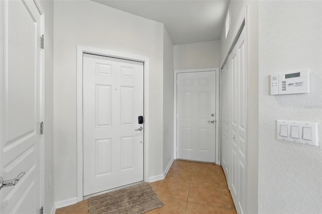 1225 Bella Cara Ct Unit 1, Davenport, FL 33896 - entryway featuring light tile patterned floors and baseboards